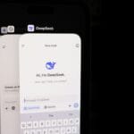 A close up of a cell phone with a keyboard