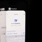 A close up of a cell phone with a keyboard