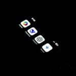 A cell phone that is lit up in the dark