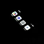 A cell phone that is lit up in the dark