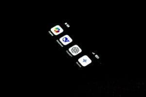 A cell phone that is lit up in the dark