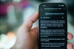 Someone is using their phone to find a restaurant.