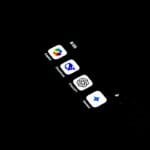 A cell phone with several icons on the screen