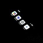 A cell phone that is lit up in the dark